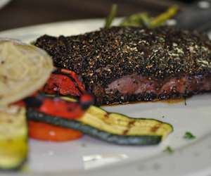 Peppercorn NY Strip with Tuscan Vegetables.